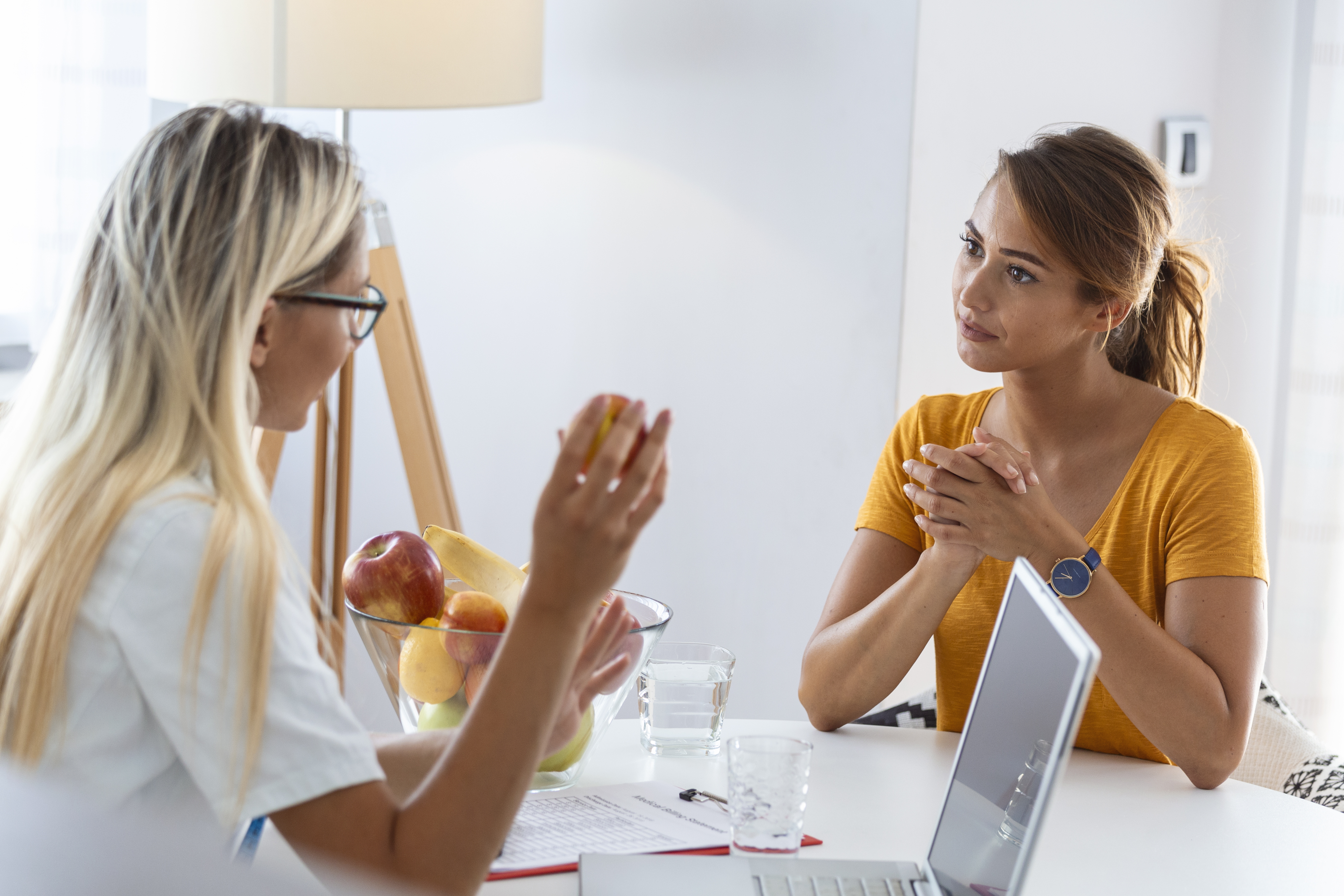 Wellness consultant reviewing an employee ergonomics dashboard